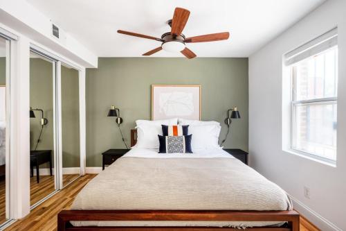 a bedroom with a bed with a ceiling fan at Dupont Circle 1BR nr U St Metro Glens Mkt WDC-179 in Washington, D.C.