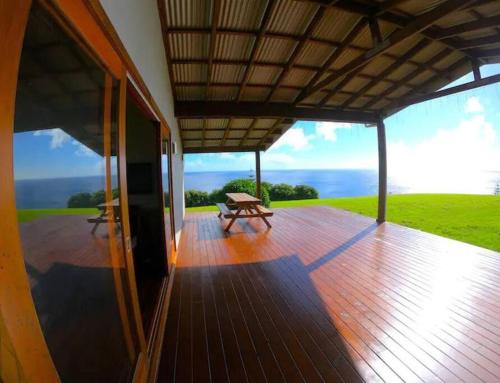 a wooden deck with a bench on top of a house at King Tide House - Ocean Views in Burnt Pine