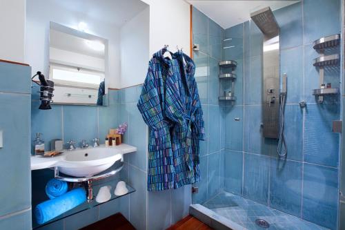 a bathroom with a sink and a shower at Faraglionensis MonaconeHouse Villa in Capri