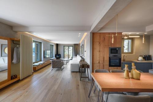 a kitchen and living room with a table and a dining room at Kale Alti residences in Mirina