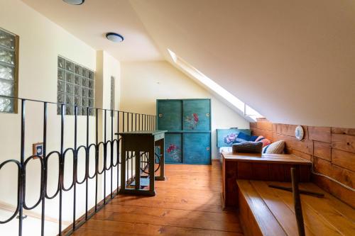 a living room with a staircase and a table at Penzión Príjemný Oddych in Banská Štiavnica