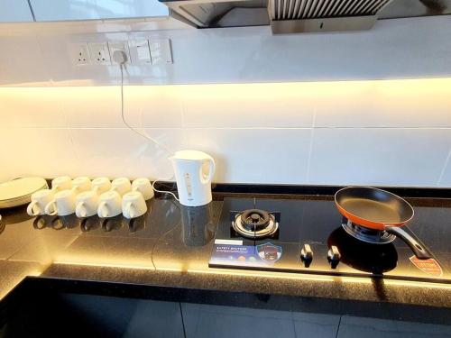 a stove top with a pot on top of it at JOVIAL SingleStorey Bungalow 4Room10Pax `Alma in Bukit Mertajam