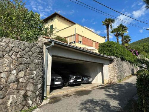 two cars are parked in a garage at Apartments Galatea with garage parking in Opatija
