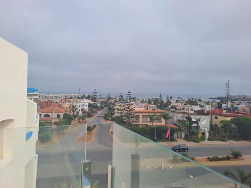 a view of a city street from a building at vacance et confort les sablettes in Mohammedia