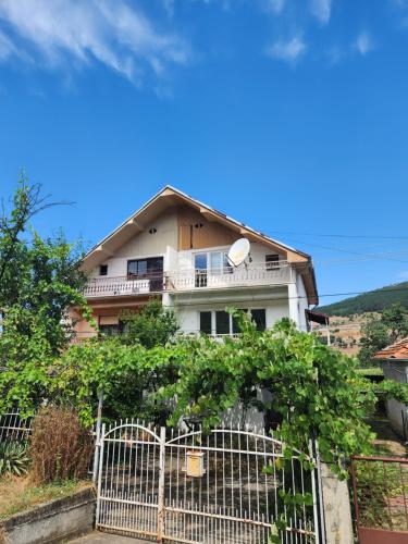 a house with a fence in front of it at House ViS in Dimitrovgrad