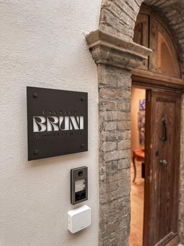 a sign on the side of a building at B&B Palazzo Bruni - Dimora di Mare in Marina San Vito