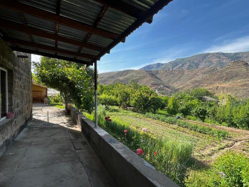 a view from the porch of a house with mountains in the background at Arpi-Ureni Guesthouse in Ertich