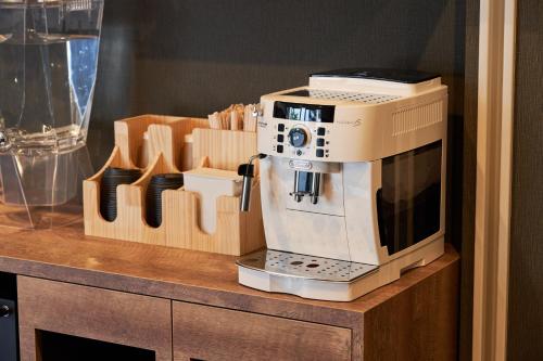 a coffee machine sitting on top of a counter at Hotel STARRIZE in Fukuoka