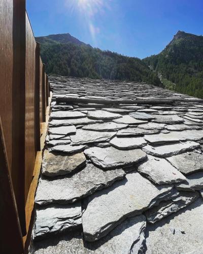 a large stone road with mountains in the background at La Rêverie de Thumel - Suite in Rhêmes-Notre-Dame