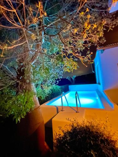 a kitchen with a sink and a window with plants at Villa Only Adults 2 Pax · Piscina Privada · A/C · WIFI · BBQ in Blanes