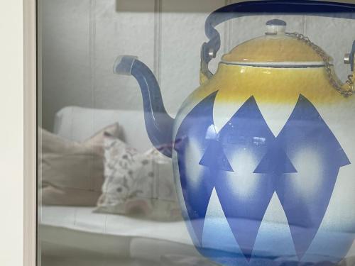 a blue and yellow vase sitting on a table at Villa Only Adults 2 Pax · Piscina Privada · A/C · WIFI · BBQ in Blanes