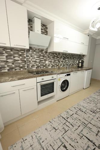 Kuchyň nebo kuchyňský kout v ubytování Golden Homes