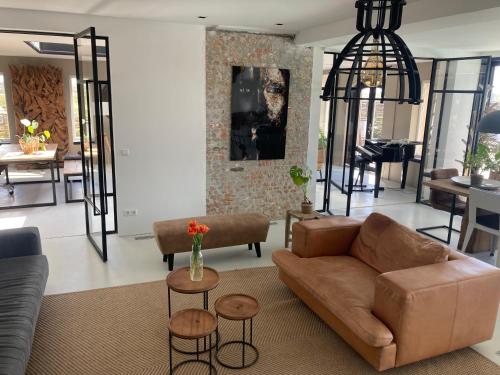 a living room with a couch and a table at Villa Zandvoort in Zandvoort