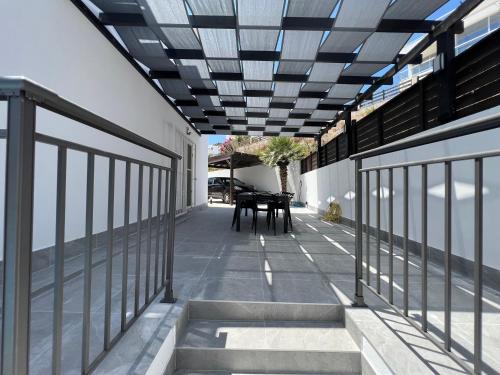 an external view of a patio with a glass ceiling at Villa Marina Sea-View Private Pool in Peyia