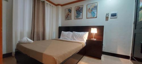 Postel nebo postele na pokoji v ubytování ISLAND VIEW SUITES