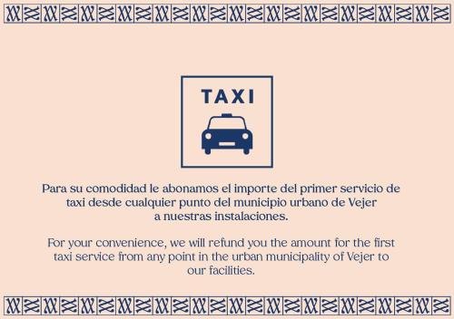 una señal para un taxi con una foto de un coche en Hotel Boutique V, en Vejer de la Frontera