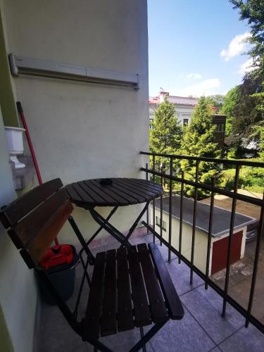 a bench sitting on the balcony of a building at APARTAMENT MARIO bezpłatny parking in Bielsko-Biala