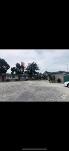 a parking lot with a car parked in front of a building at Horsham Motel in Horsham