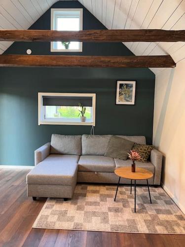 a living room with a couch and a table at Araya Svensson’s Guest House in Falkenberg