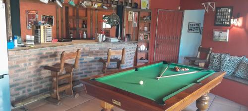 a pool table in a room with a bar at Serenity Place Garden View in Durban