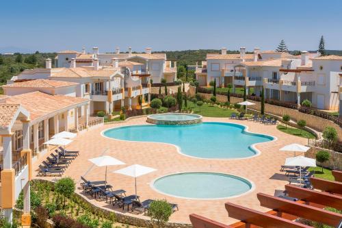 an image of a swimming pool in a resort at NAU Salema Beach Village in Salema