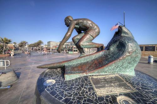 a statue of a man riding a whale at The Sea View Inn At The Beach in Manhattan Beach