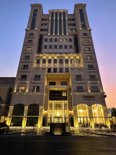 a tall building with lights in front of it at The Address Serviced Apartments in Al Khobar