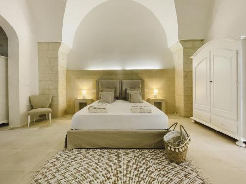 Postel nebo postele na pokoji v ubytování Masseria Paralupi