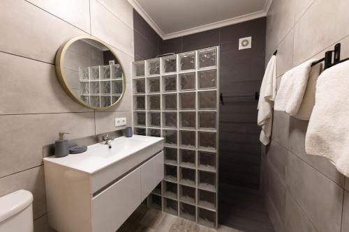 a bathroom with a sink and a mirror at SWEET home I in Caniçal