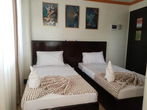 Postel nebo postele na pokoji v ubytování ISLAND VIEW SUITES