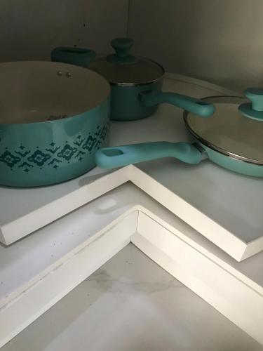 a table with a pot and a bowl on it at The Havens hideaway in Freeport