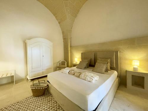Ένα ή περισσότερα κρεβάτια σε δωμάτιο στο Masseria Paralupi