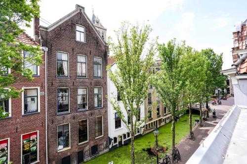 a view of a street with buildings and trees at Beautiful Apartment With Loft in Delft