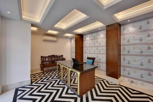 an office with a desk with a laptop on it at The Fern Bambora Fort, Bambora, Udaipur in Udaipur
