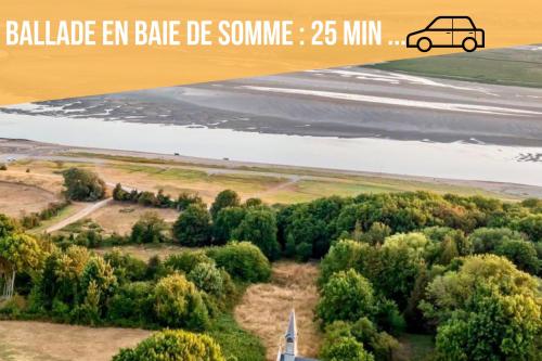 an aerial view of an airport with a car on a runway at " Tchio Batteux" les Gîtes de Sery in Bouillancourt-en-Séry