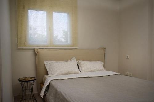 Ένα ή περισσότερα κρεβάτια σε δωμάτιο στο SeaView Apartment Megas Limnionas