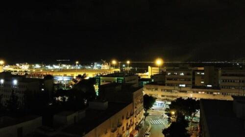 a view of a city at night with lights at Diana Hotel in Haifa