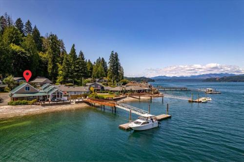 a boat is docked at a dock in the water at Utopia Cove in Union