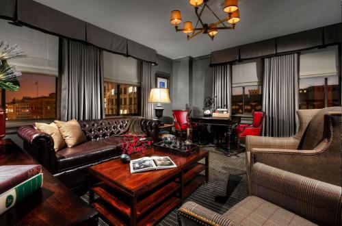 a living room with a couch and a table at Los Angeles Athletic Club in Los Angeles