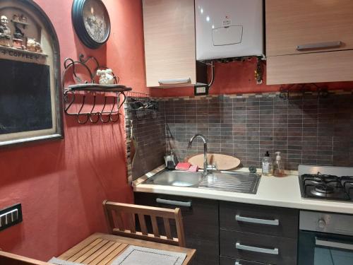 a small kitchen with a sink and a counter at Casita Esperanza in Copparo