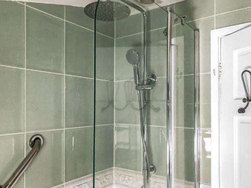 a shower with a glass door in a bathroom at Foxes Reach in Trelleck