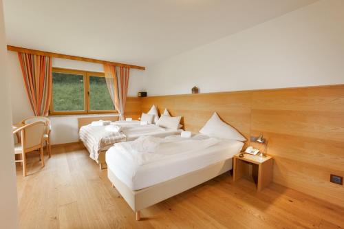 Katil atau katil-katil dalam bilik di Hotel Künstleralm