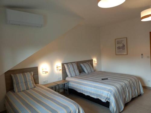 Postel nebo postele na pokoji v ubytování Haut de villa avec piscine