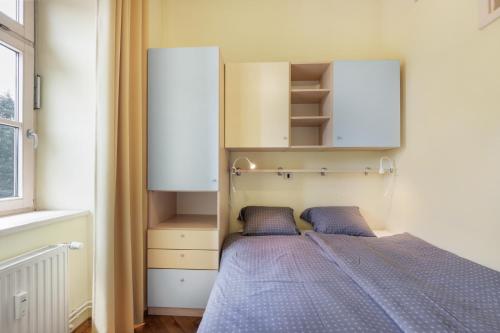 Postel nebo postele na pokoji v ubytování ROG Apartment with Balcony