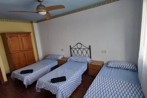 Cama o camas de una habitación en Gran Casa Rural en Benissa