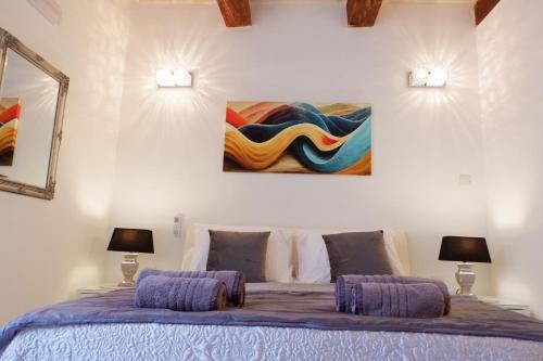 Postel nebo postele na pokoji v ubytování SPQR Studios 2 Valletta