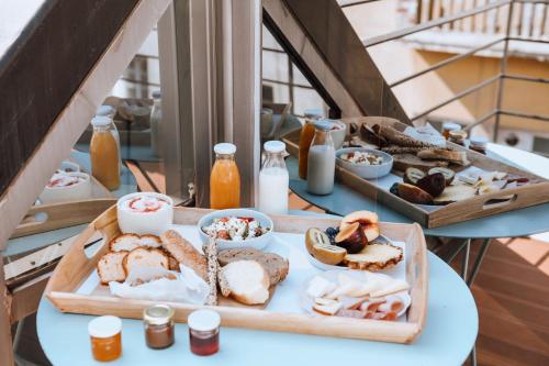a table with two trays of different types of food at The Caravan in Thessaloniki