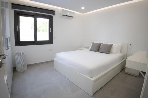 Ένα ή περισσότερα κρεβάτια σε δωμάτιο στο Phaedrus Living: Luxury Mackenzie Flat