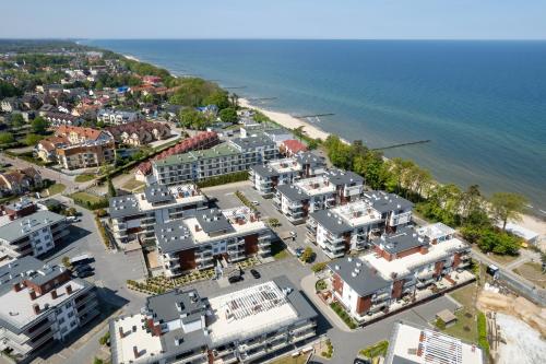 an aerial view of a city next to the water at Apartments Klifowa Resort with SPA, Fitness & Kids Room by Renters in Rewal