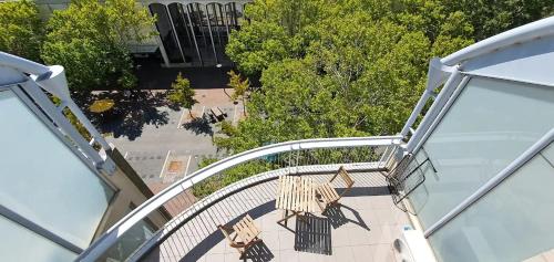 an overhead view of a spiral walkway with chairs on it at Dana-Cozy Private Room in Shared Central Apt-Rm 1 in Canberra